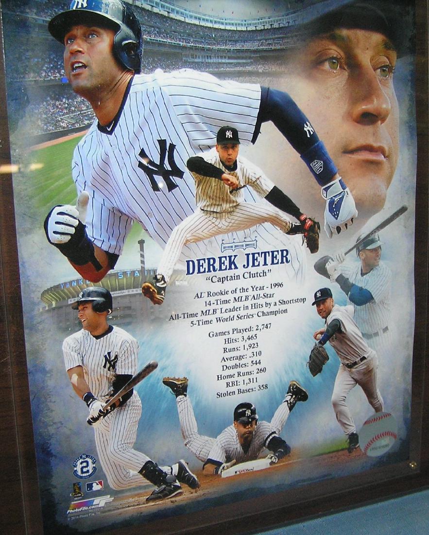 Vintage Derek Jeter photo and baseball card wall plaque: Vintage Derek Jeter photo and baseball card wall plaque titled Capt. Clutch est. value $65.00-$75.00