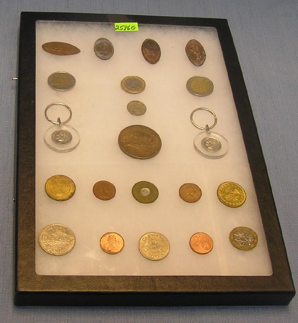 Souvenir stamped pennies, world coins & more: Collection of souvenir stamped pennies, world coins, tokens and the US mint bronze medallion est. value $50.00-$75.00