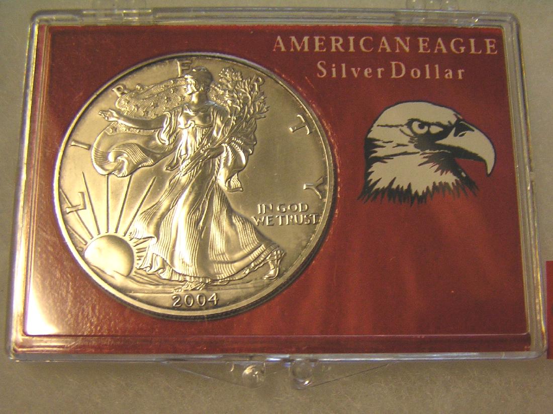 2004 Walking Liberty American Eagle silver dollar: 2004 Walking Liberty American Eagle silver dollar uncirculated in display case est. value $50.00-$60.00