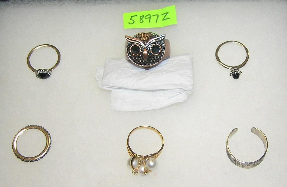 Group of quality costume jewelry rings: Group of quality costume jewelry rings including a figural owl watch ring est. value $35.00-$45.00