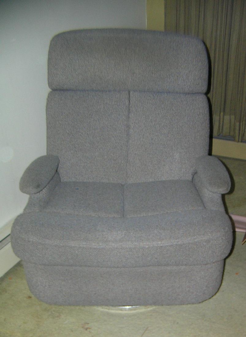 Modern reclining arm chair with retractable foot rest: Modern reclining arm chair with retractable foot rest part of a moving and storage company seized or unclaimed merchandise group sent to auction for liquidation est. value $125.00-$150.00