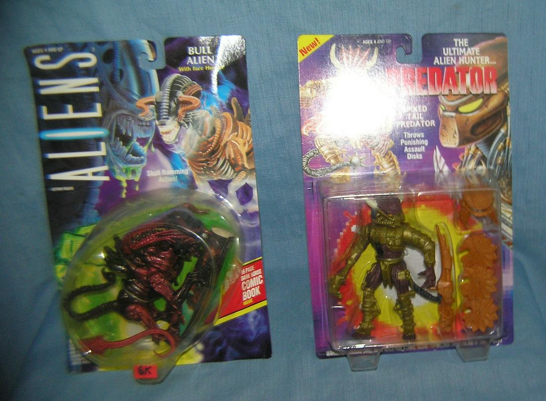 Pair of vintage Alien action figures: Pair of vintage Alien action figures includes Bull Alien with Face Hugger and Spiked Tail Preditor that throws puishing assault discs both mint on card est. value $40.00-$50.00