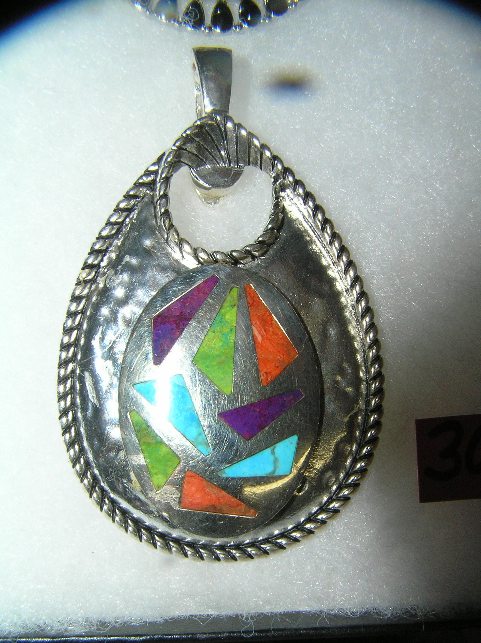 Necklace pendant with multi colored turquoise stones: Vintage necklace pendant with multi colored turquoise stones on silver base metal est. value $50.00-$60.00