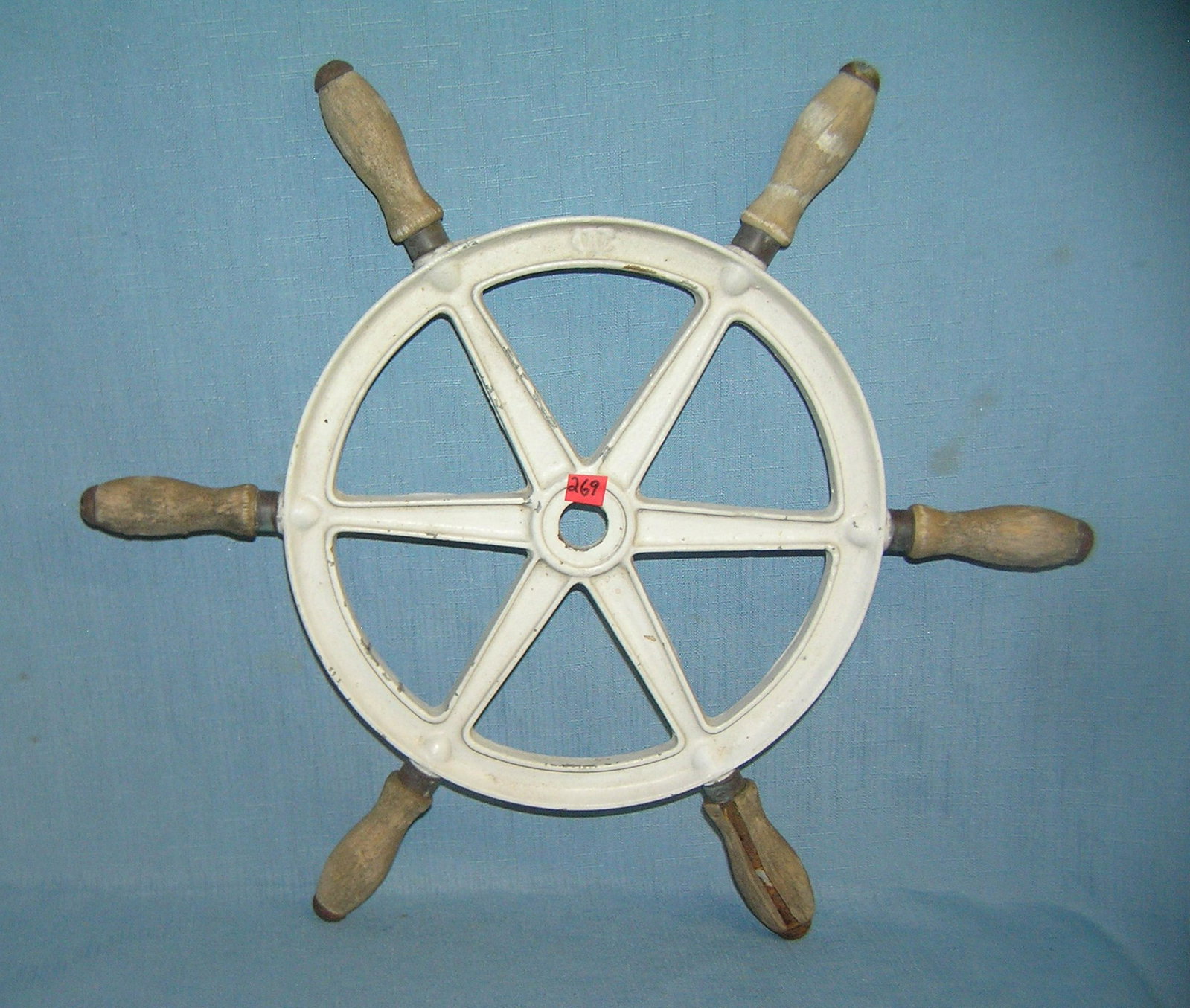 Cast iron and wood ship's wheel: Cast iron and wood ship's wheel heavy 16 inch nautical wheel stamped CAW est. value $50.00-$60.00