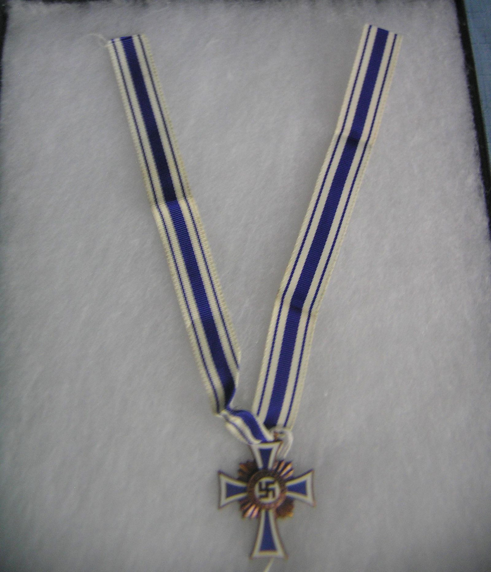 WWII Nazi mother's Cross dated Dec. 16th, 1938: WWII Nazi mother's Cross of Honor and ribbon dated December 16th, 1938 est. value $300.00-$350.00