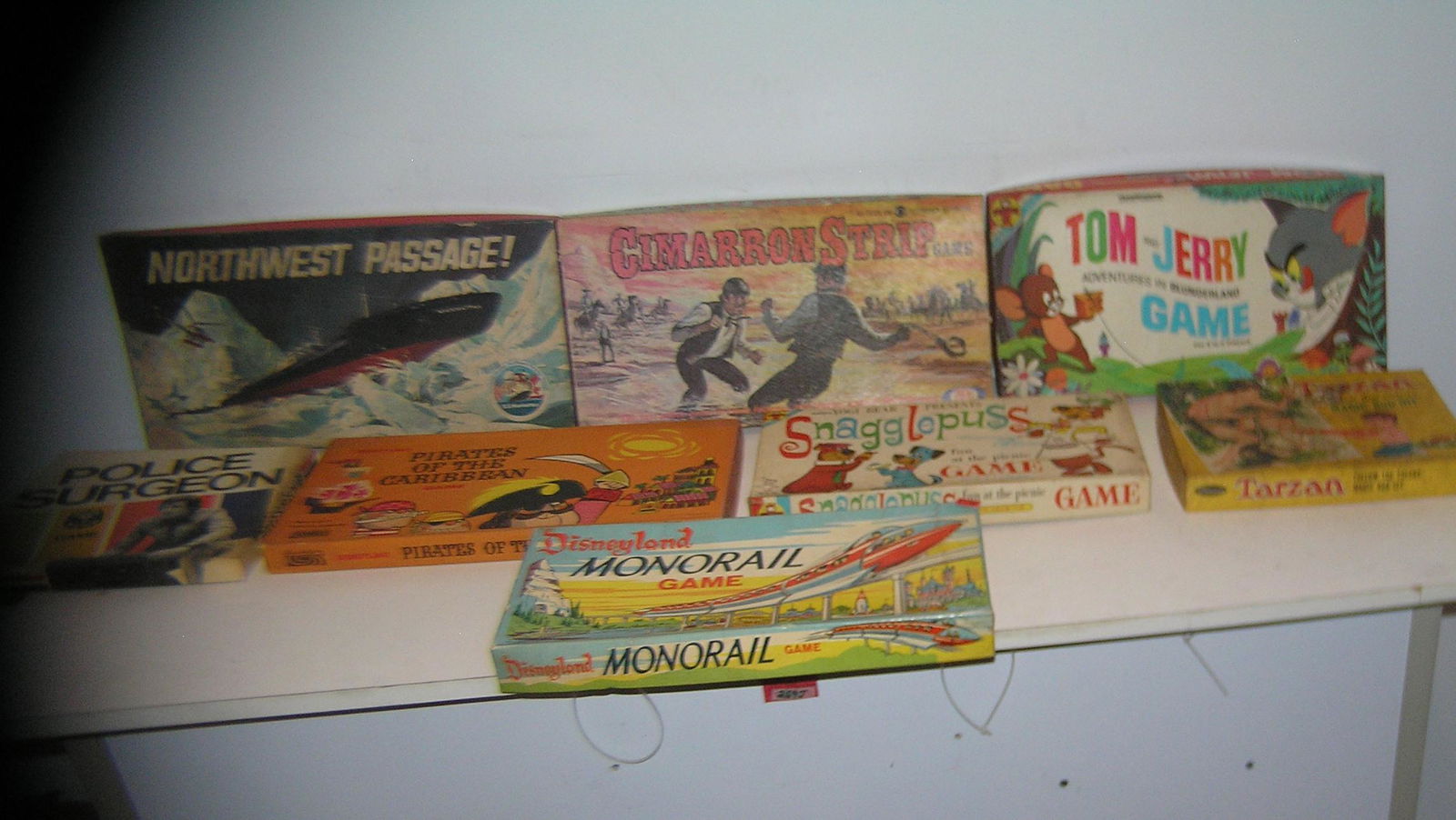 Large collection of great vintage games: Large collection of great vintage games includes Disneylands monorail, Disney's Pirates of the Carribean, Yogi Bear's Snaggle Puss, Tarzan, Tom and Jerry and more est. value $175.00-$200.00