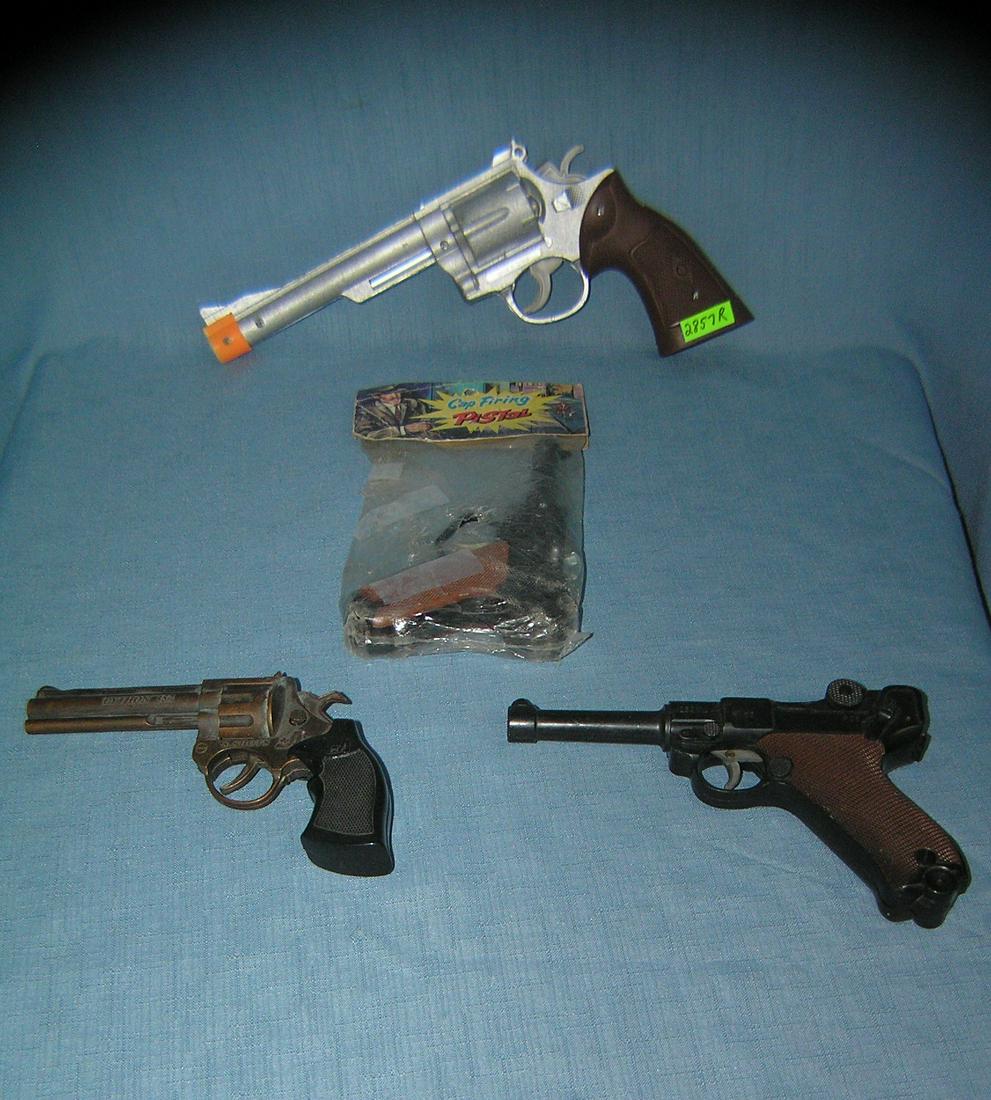 Group of 4 vintage toy plastic cap guns and more.: Group of 4 vintage toy plastic cap guns and more. est. value $40.00-$45.00