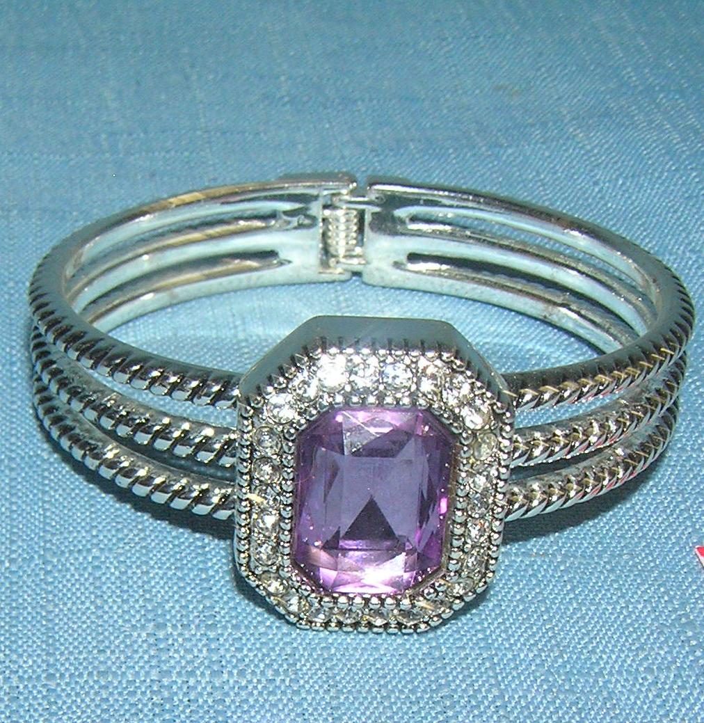 High quality silver tone bracelet: High quality silver tone bracelet with large purple stone surrounded by simulated diamond stones est. value $30.00-$40.00