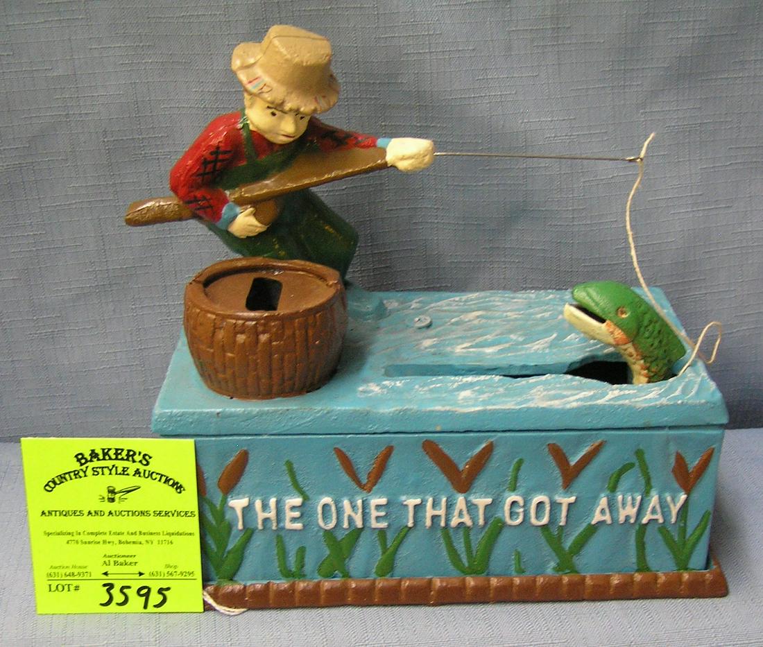 The One That Got Away fisherman bank: Hand painted cast iron The One That Got Away fisherman mechanical bank mint with original box circa 1962 est. value $150.00-$200.00