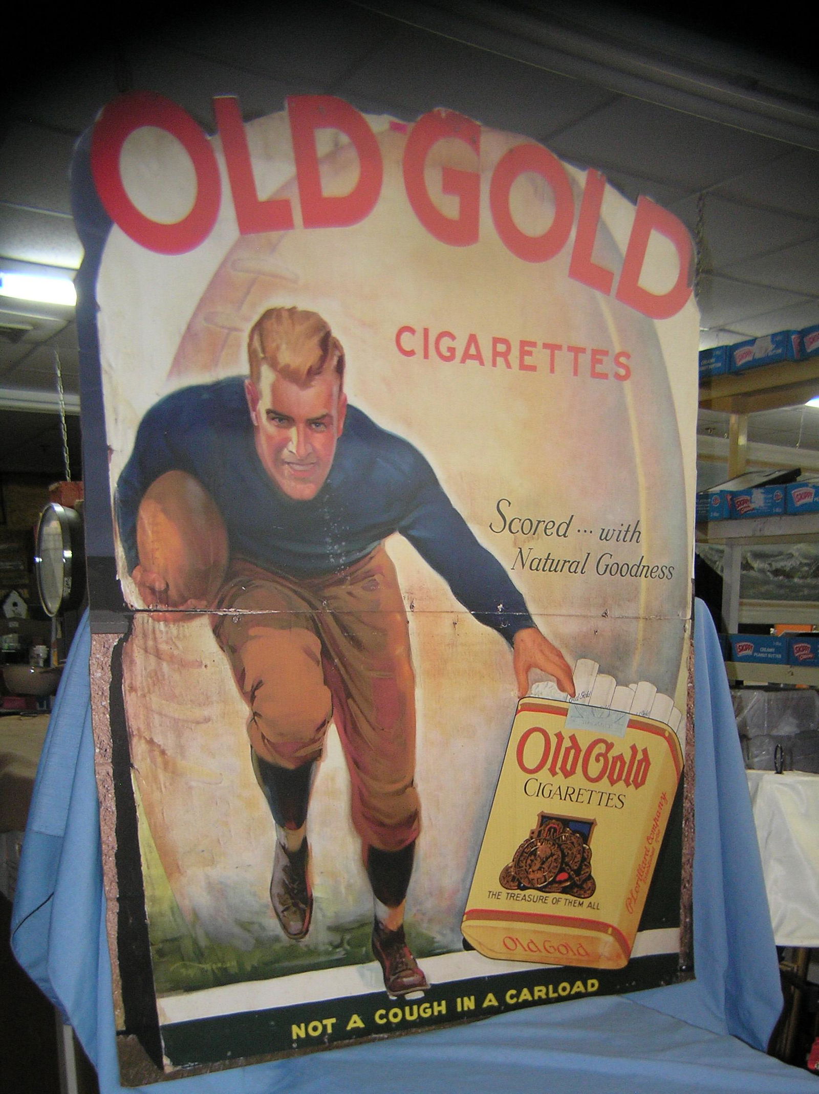 Large Old Gold cigarettes retro advertising sign: Large Old Gold cigarettes retro advertising sign featuring football player promoting Old Gold cigarettes 36 inches wide by 48 inches tall est. value $300.00-$400.00