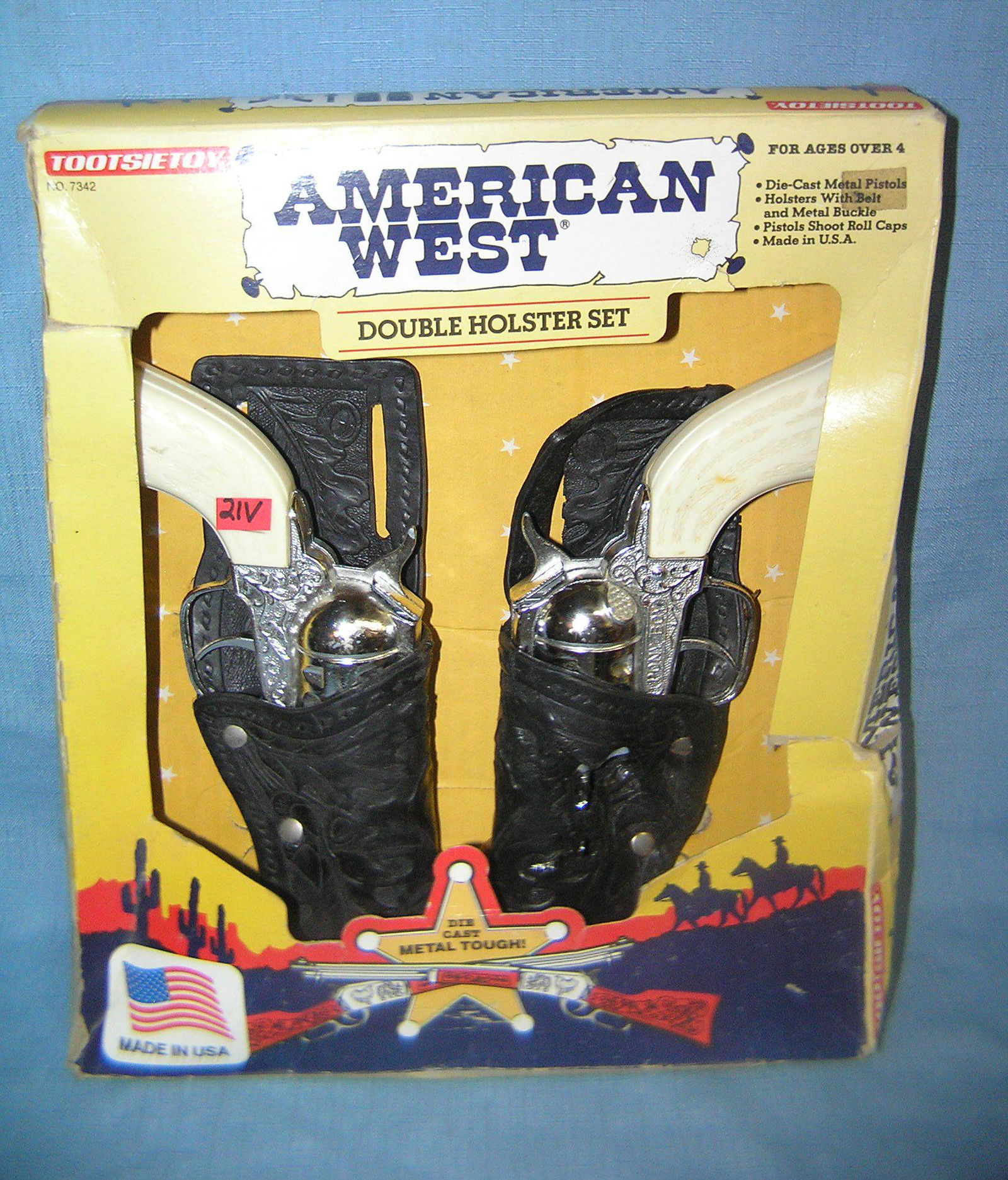 American Western cap gun set by Tootsie Toys: American Western cap gun set by Tootsie Toys with original box both guns are in excellent condition, 1 holster has heat damage otherwise excellent, guns are marked Pony Boy est. value $175.00-$200.00