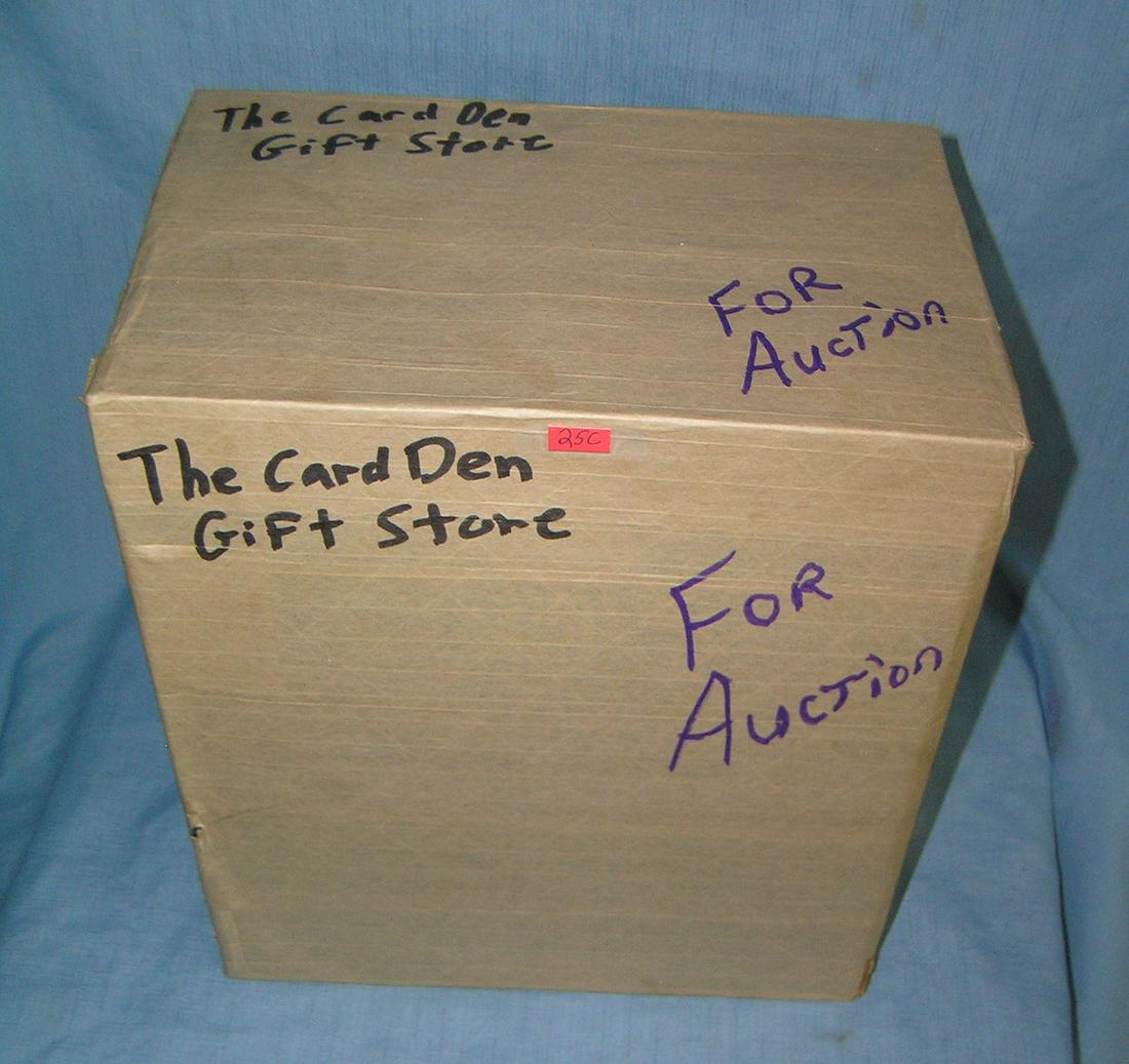 Mystery box lot marked The Card Den Gift Store: Moving and Storage Company mystery box lot marked The Card Den Gift Store part of a moving and storage company seized or unclaimed merchandise group sent to auction for liquidation est. value $40.00-5