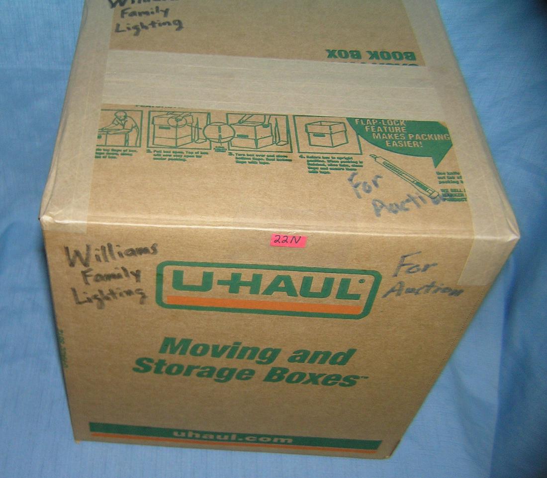 Mystery box lot marked William's family lighting: Mystery moving and storage Co. box lot marked William's family lighting part of a moving and storage company seized or unclaimed merchandise group sent to auction for liquidation est. value $40.00-$50