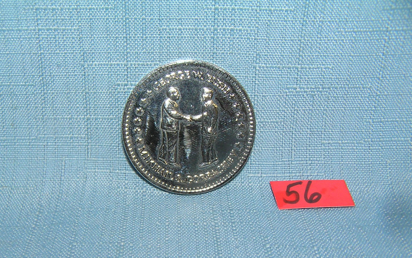 George H. W. Bush/Gorbachev double eagle coin: George H. W. Bush and Mikhail Gorbachev double eagle commemorative coin in silver tone est. value $35.00-$40.00