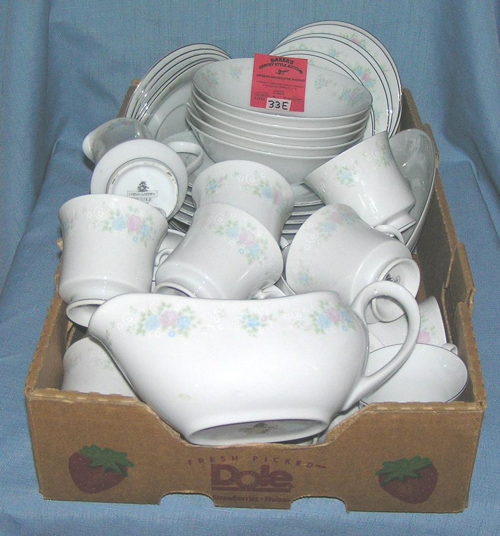 Box of floral decorated dinnerware by China Garden: Large box full of floral decorated dinnerware by China Garden, 43 pieces est. value $175.00-$200.00