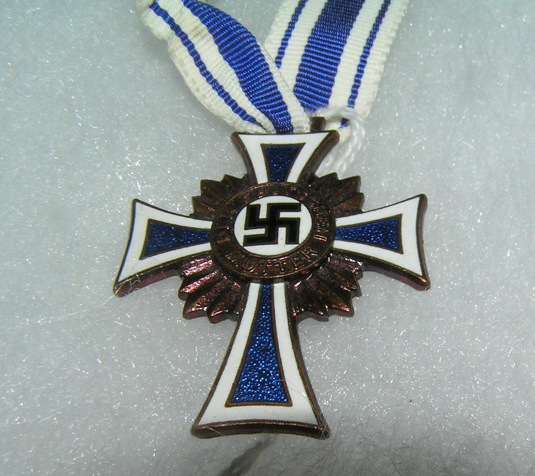 WWII Nazi mother's Cross dated Dec. 16th, 1938: WWII Nazi mother's Cross of Honor and ribbon dated December 16th, 1938 est. value $300.00-$350.00