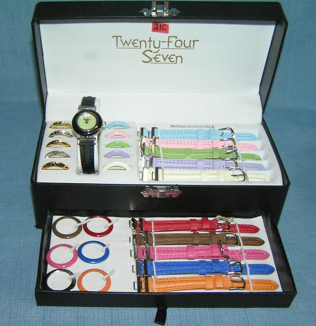 24/7 interchangeable watch kit: 24/7 interchangeable watch kit with multiple colored face trim and bands in a great collectible display box est. value $50.00-$75.00