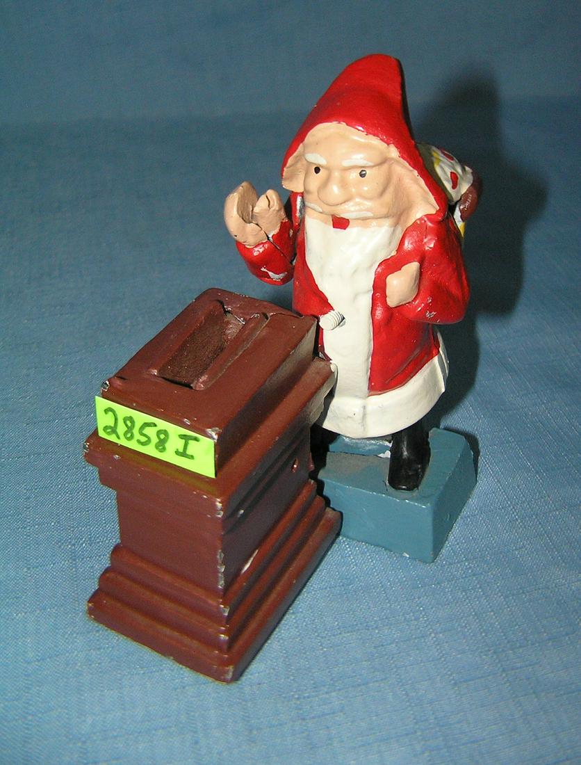 Cast iron Santa Claus mechanical bank: Cast iron hand painted Santa Claus mechanical bank est. value $100.00-$125.00