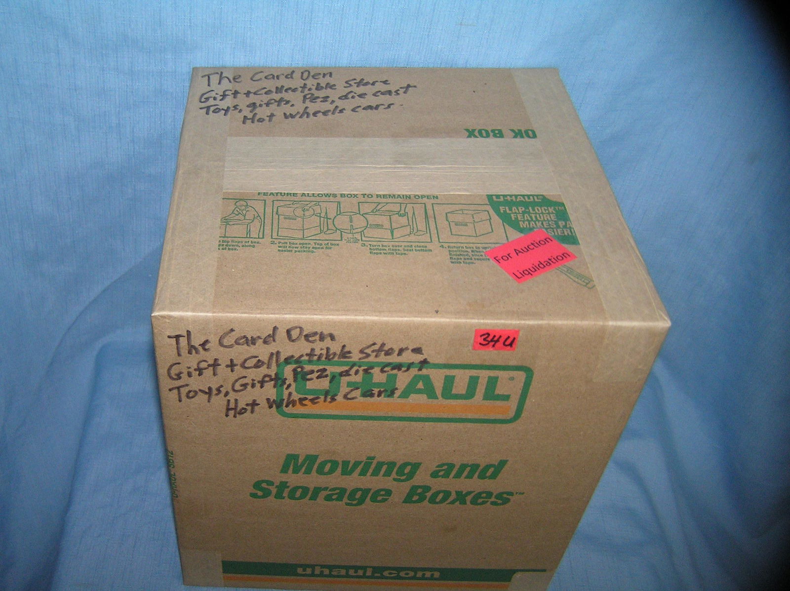 Moving and Storage Company mystery box lot marked The: Moving and Storage Company mystery box lot marked The Card Den gift and collectible store toys, gifts, Pez, die cast, Hot Wheel cars and more part of a moving and storage company seized or unclaimed m