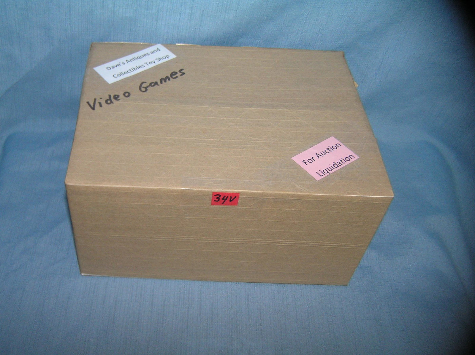 Moving and Storage Company mystery box lot marked: Moving and Storage Company mystery box lot marked Dave's Antiques and Collectibles Toy Shop video games part of a moving and storage company seized or unclaimed merchandise group sent to auction for l