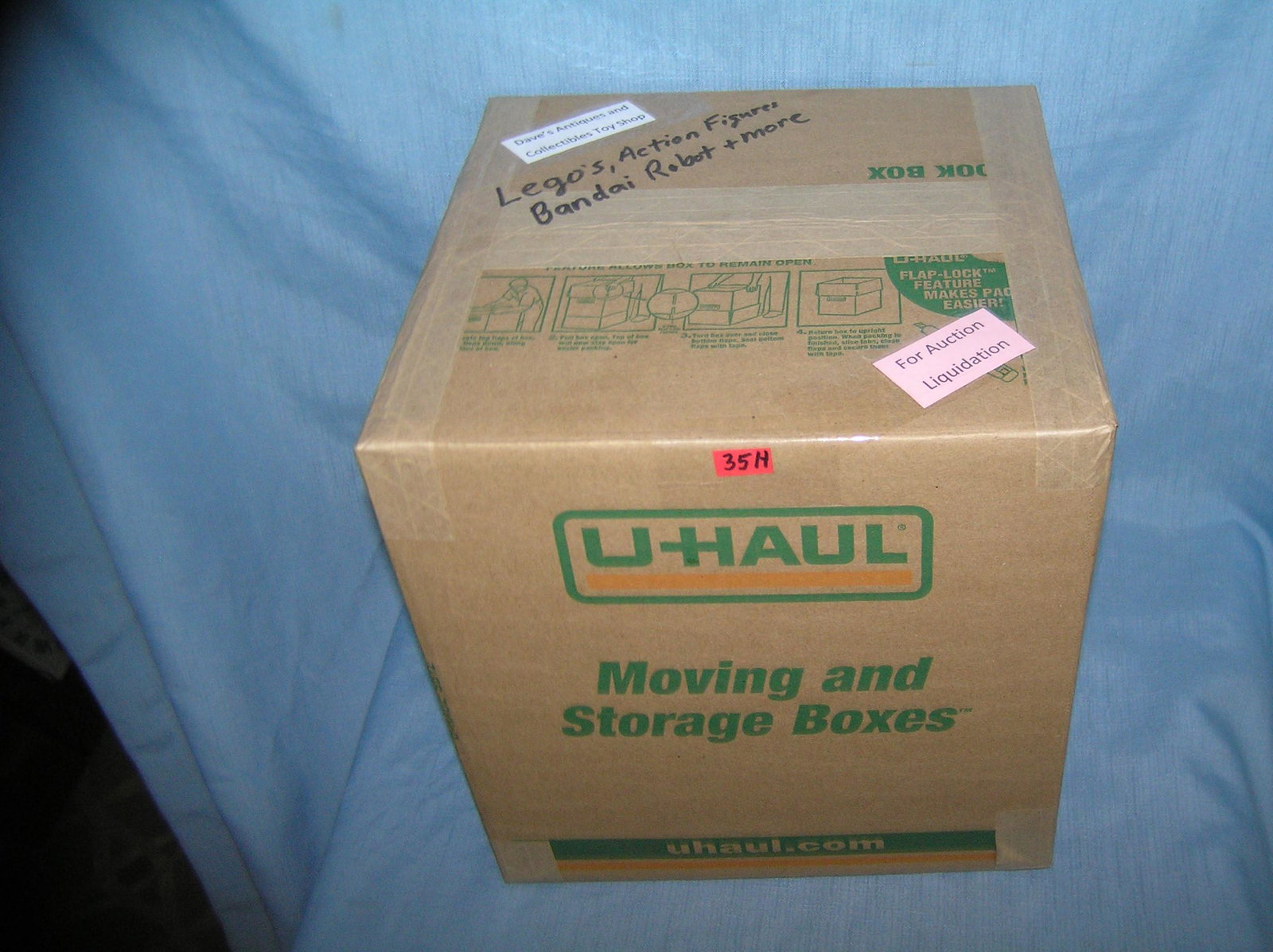 Moving and Storage Company mystery box lot marked: Moving and Storage Company mystery box lot marked Dave's Antiques and Collectibles Toy Shop marked Lego's, action figures, Bandai robot and more from a Long Island antique and collectibles store close