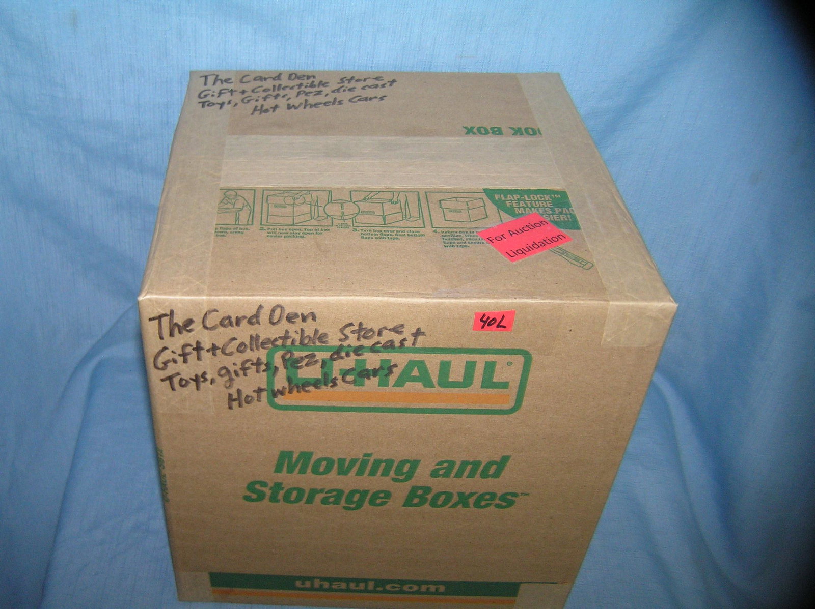 Moving and Storage Company mystery box lot marked The: Moving and Storage Company mystery box lot marked The Card Den Gift and Collectible's store includes toys, gifts, Pez, die cast and Hot Wheel's cars part of a moving and storage company seized or uncl