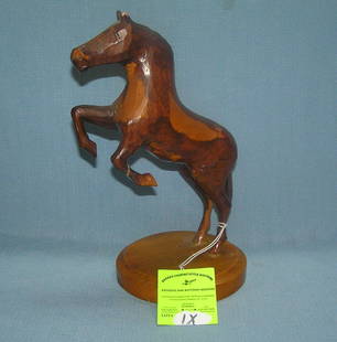 Prison made Hand carved prancing horse: Prison made Hand carved prancing horse on base hand carved by Maine State prison inmate, stamped on base est. value $75.00-$100.00