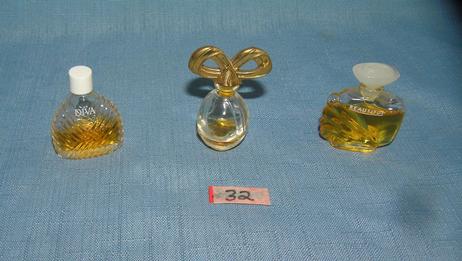 Group of miniature perfume bottles: Group of miniature perfume bottles est. value $30.00-$35.00