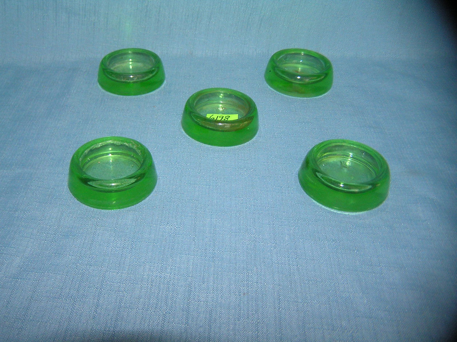 Group of 5 green Depression glass furniture coasters: Group of 5 green Depression glass furniture coasters est. value $30.00-$50.00