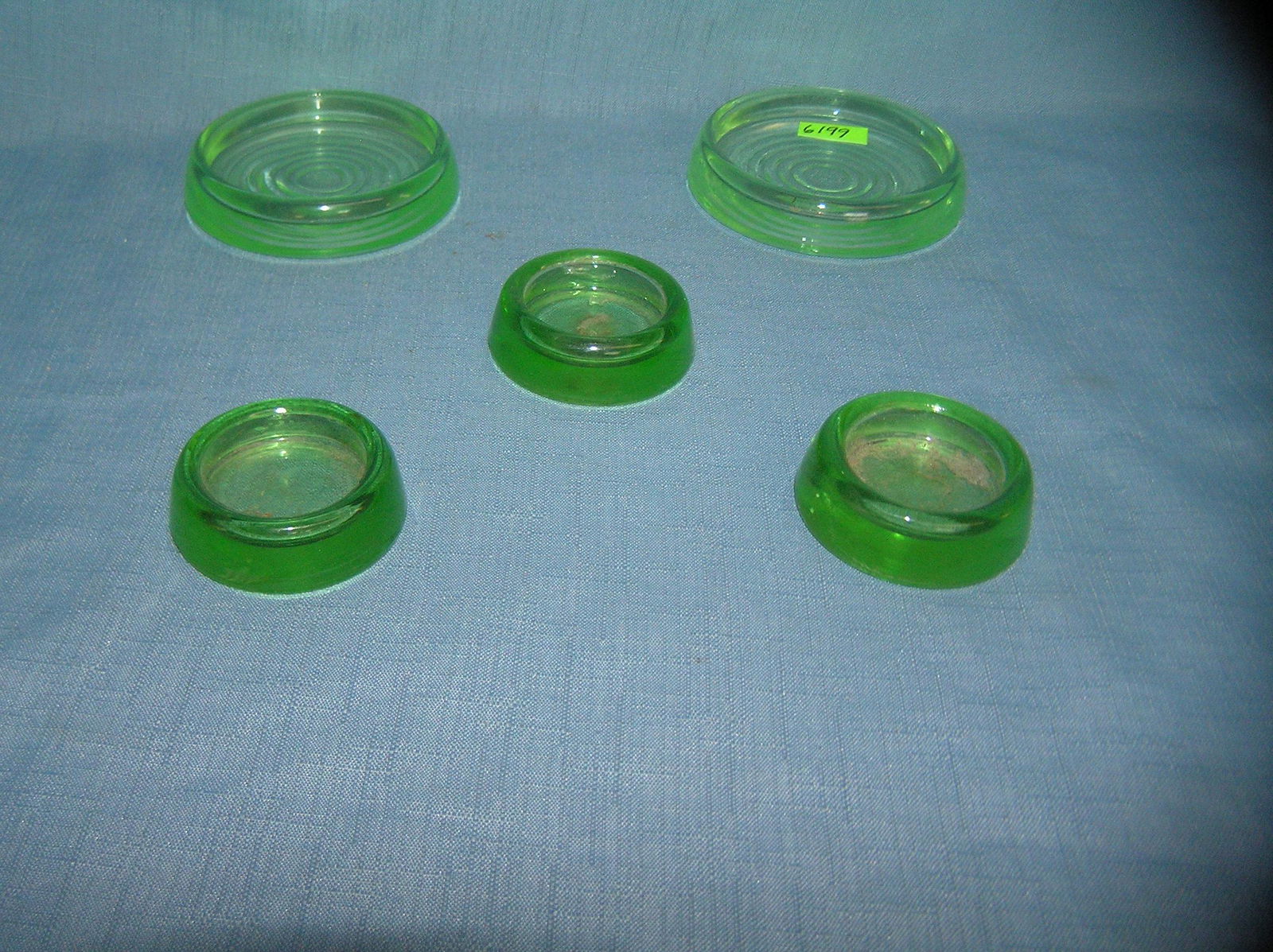Group of 5 green Depression glass furniture coasters: Group of 5 green Depression glass furniture coasters est. value $30.00-$50.00