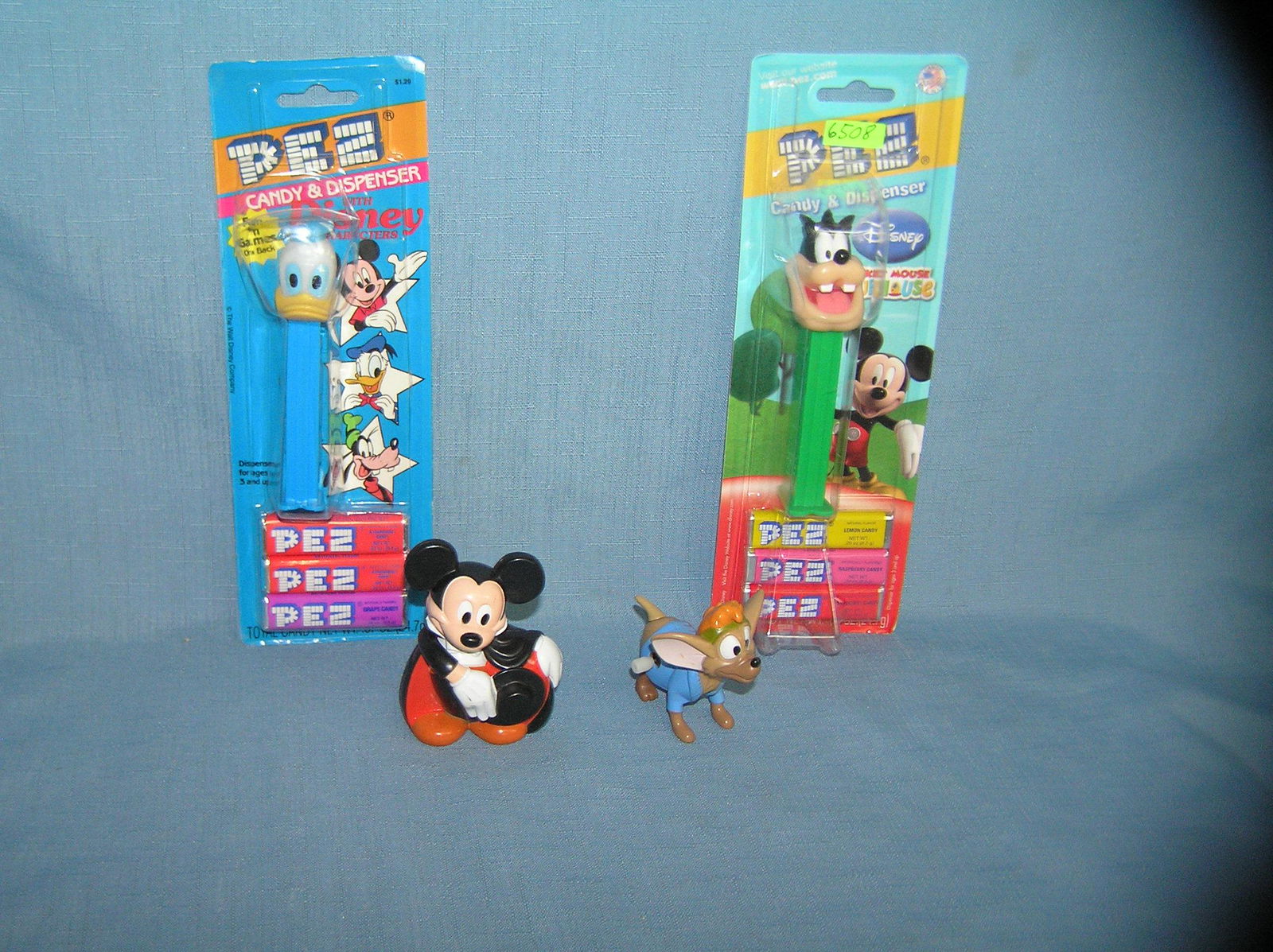 Group of vintage Disney PEZ candy containers and toys: Group of vintage Disney PEZ candy containers and toys PEZ is mint on card est. value $30.00-$35.00