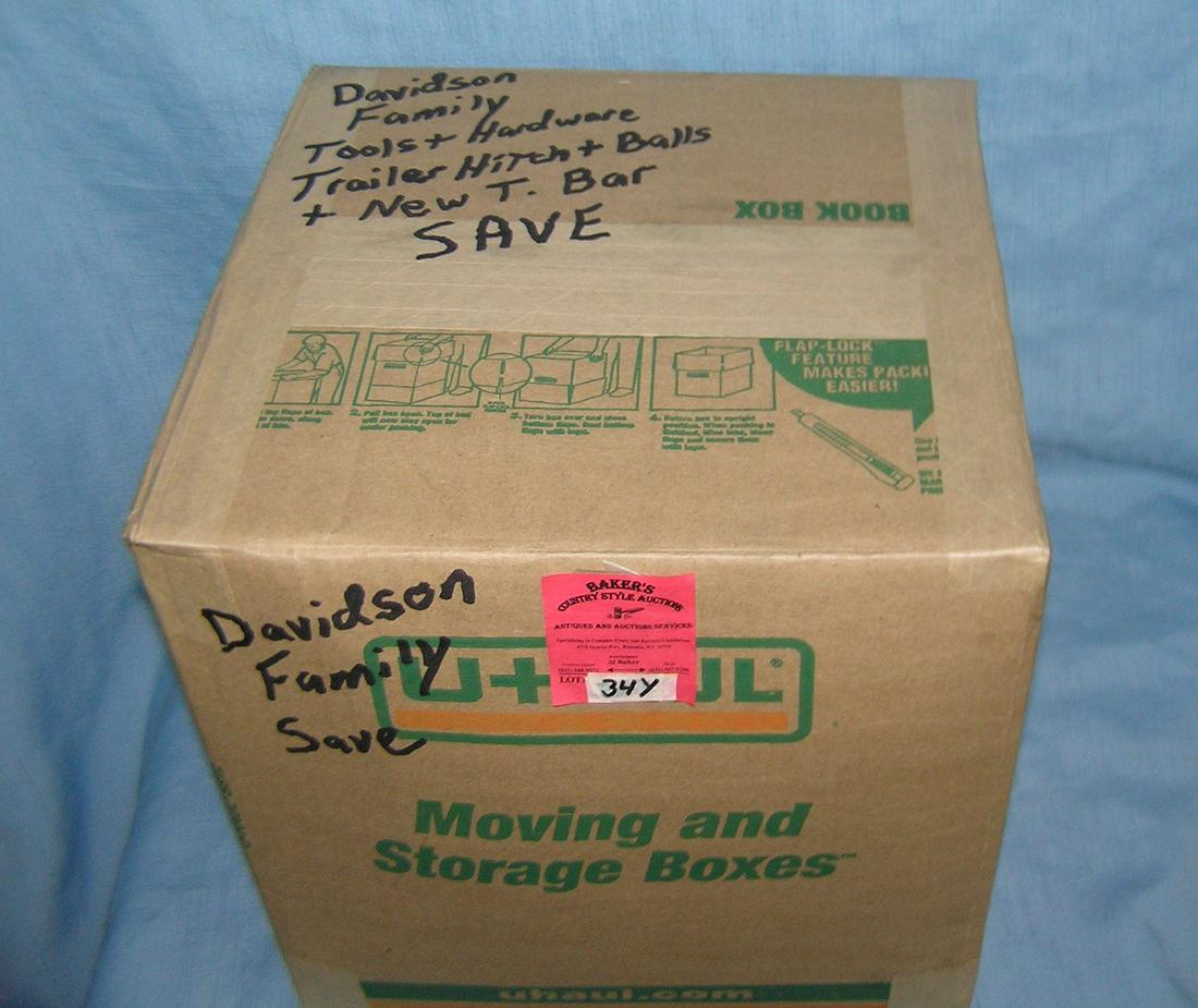 Moving and Storage Company mystery box: Moving and Storage Company mystery box lot marked Davidson Family tools, hardware, trailer hitch and balls and new T-bar part of a moving and storage company seized or unclaimed merchandise group sent