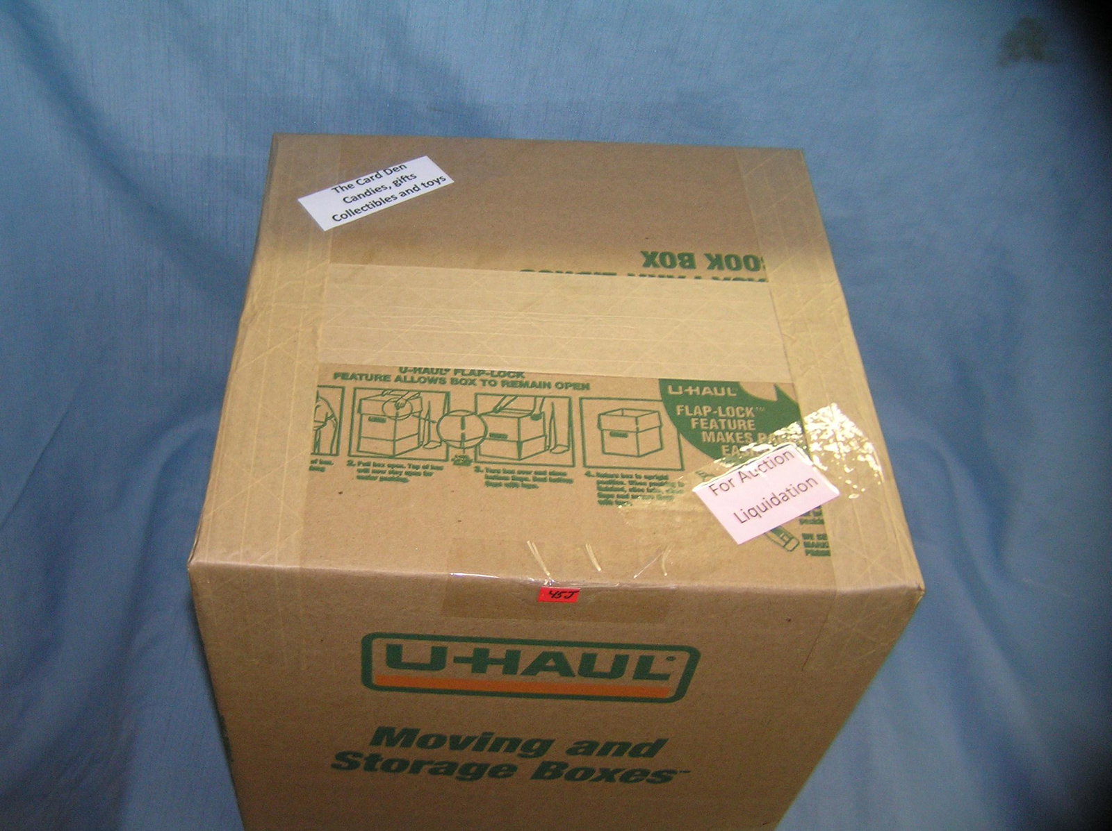 Moving and Storage Company mystery box lot: Moving and Storage Company mystery box lot marked The Card Den Candies, Gifts, Collectibles and Toys.part of a moving and storage company seized or unclaimed merchandise group sent to auction for liqu