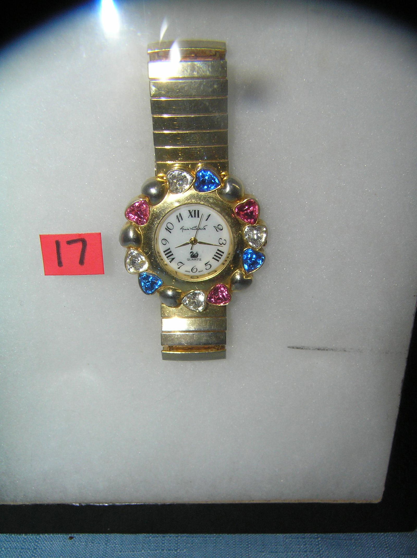 Gloria Vanderbilt high quality designer wrist watch: Gloria Vanderbilt high quality designer wrist watch gold toned with multi colored heart shaped stones est. value $65.00-$75.00