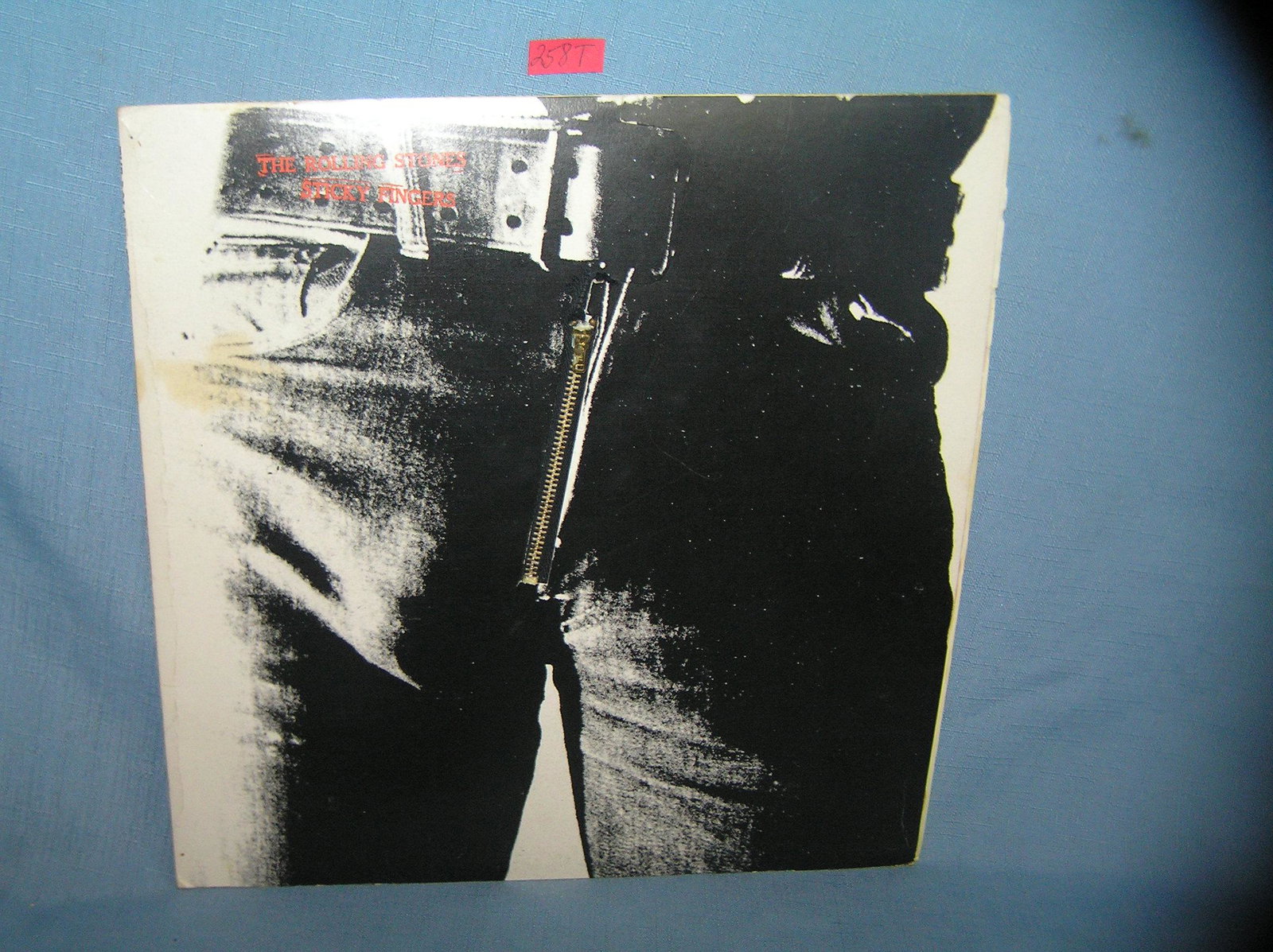 Vintage Rolling Stones Sticky Fingers record album: Vintage Rolling Stones Sticky Fingers record album cover designed by artist Andy Warhol known as the zipper album with original paper sleeve record appears to be near mint est. value $125.00--$150.00
