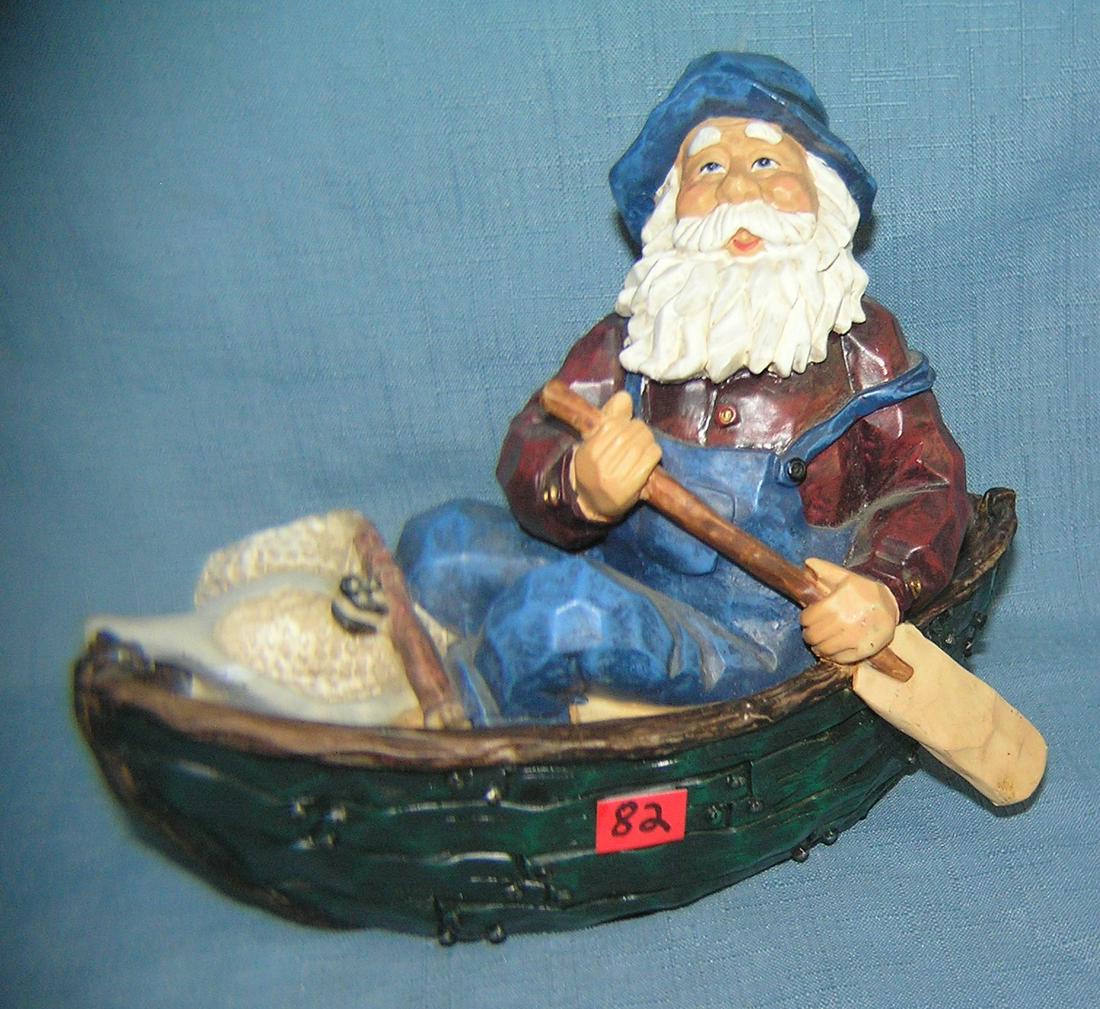 Hand painted fisherman in rowboat figurine: Hand painted fisherman in rowboat figurine est. value $30.00-$35.00