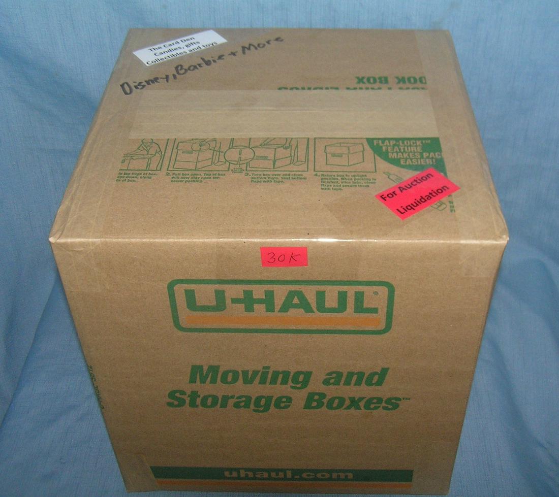 Moving and Storage Company mystery box lot: Moving and Storage Company mystery box lot marked The Card Den, candies, gifts, collectibles and Toys; Disney, Barbie and more part of a moving and storage company seized or unclaimed merchandise grou