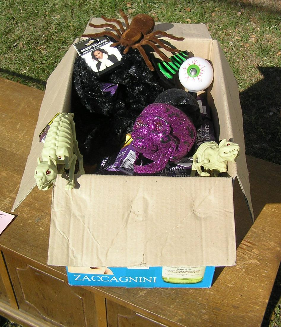 Box full of Halloween decorations: Box full of Halloween decorations est. value $65.00-$75.00