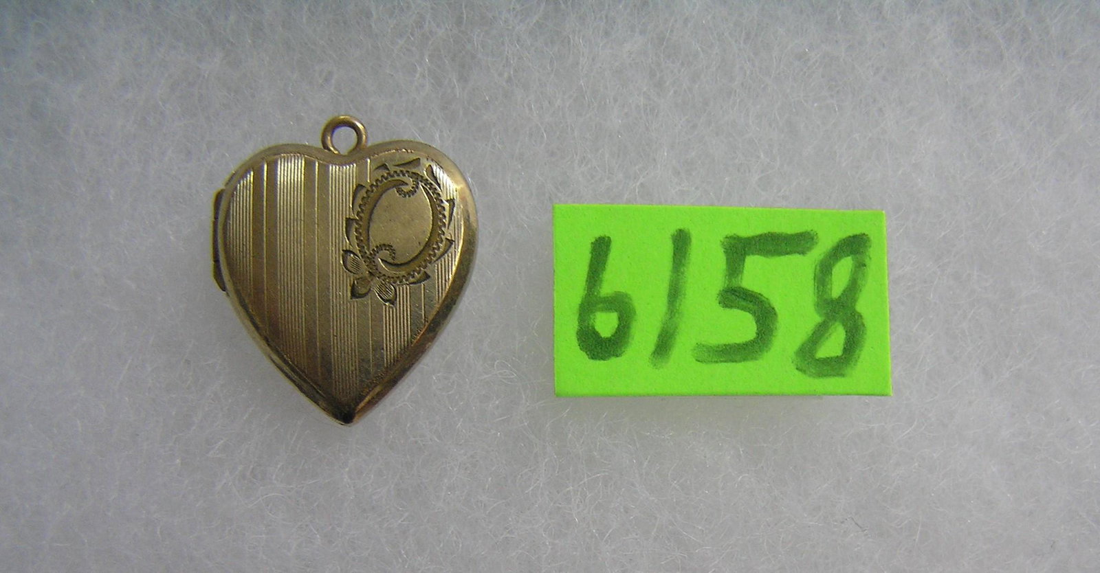 Collection of Pokemon collector cards: Antique gold filled heart locket est. value $40.00-$50.00