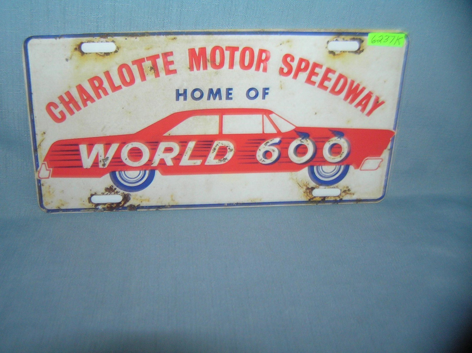Chalotte Motor Speedway home of the world 600 sign: Chalotte Motor Speedway home of the world 600 License plate size wall or car advertising sign est. value $25.00-$30.00