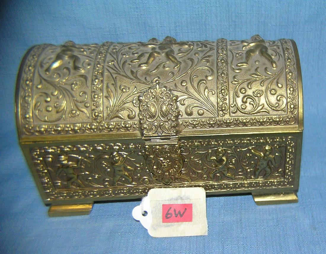 Cherub decorated brass jewelry and trinket chest: Cherub decorated brass jewelry and trinket chest est. value $65.00-$75.00