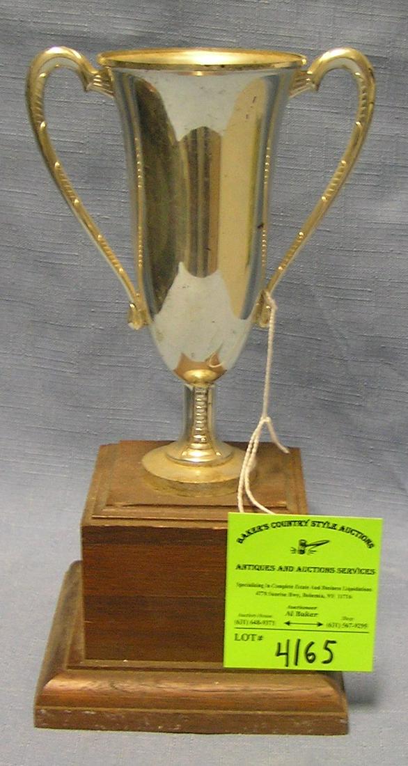 Vintage silver plated presentation trophy on wood base: Vintage 9’’ silver plated presentation trophy on wood base $50.00-$75.00