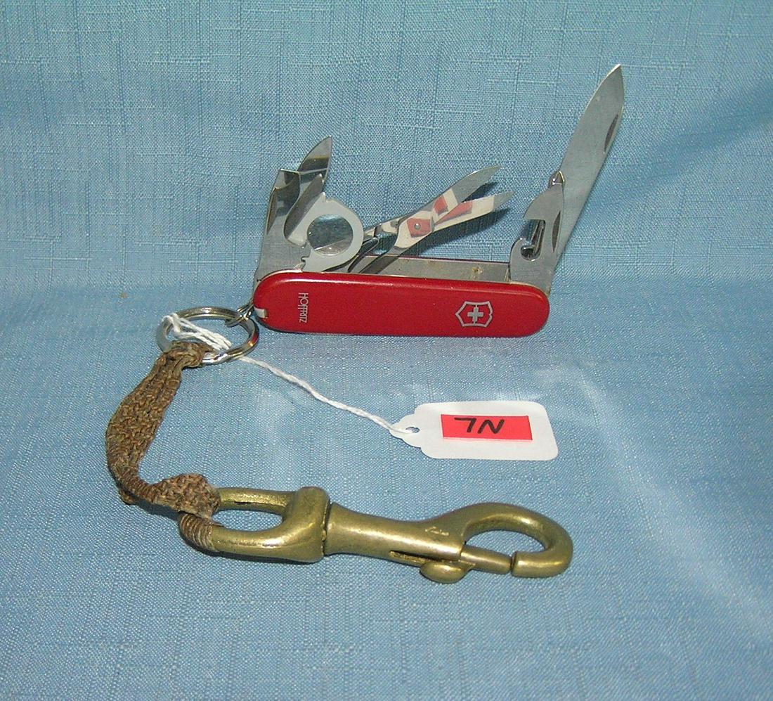 Vintage Hoffritz Swiss Army knife: Vintage Hoffritz Swiss Army knife with belt loop hook and carrier est. value $40.00-$50.00