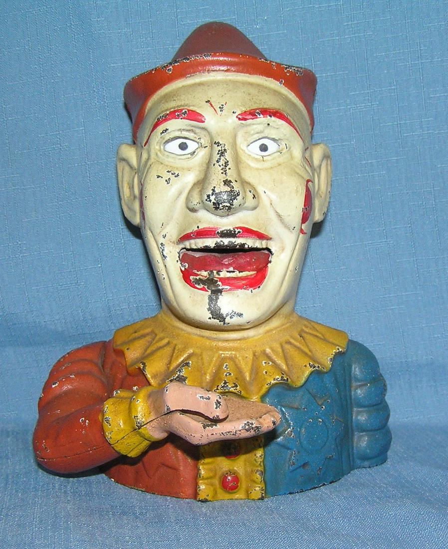 Humpty Dumpty the clown mechanical bank: Humpty Dumpty the clown hand painted and cast iron mechanical bank from the Book of Knowledge series circa 1956 est. value $275.00-$300.00