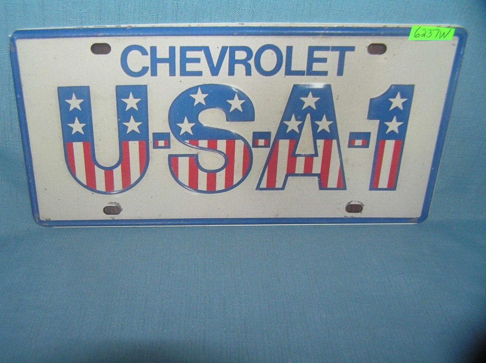 Chevrolet USA License plate size wall or car sign: Chevrolet USA License plate size wall or car advertising sign est. value $25.00-$30.00