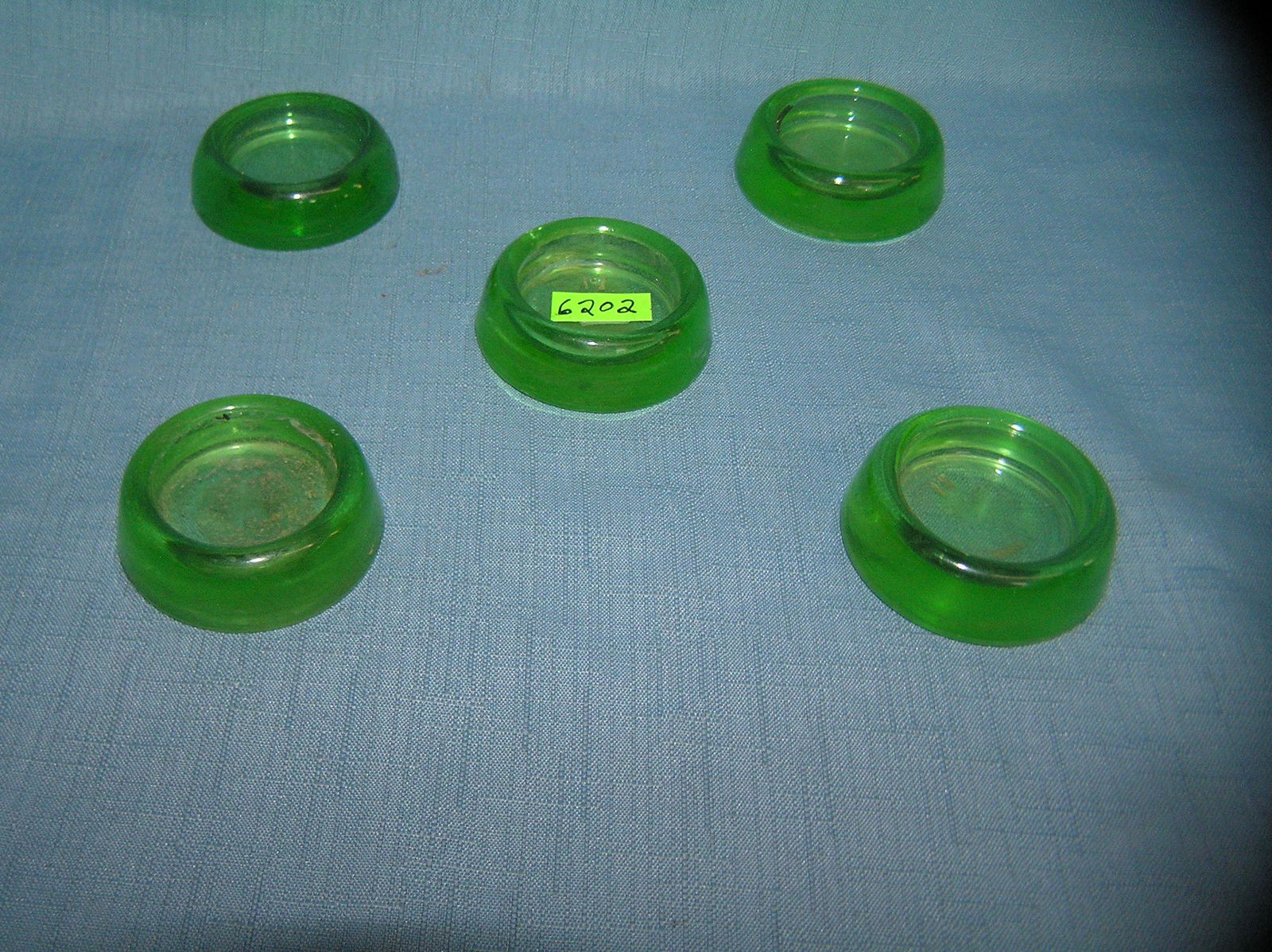 Group of 5 green Depression glass furniture coasters: Group of 5 green Depression glass furniture coasters est. value $30.00-$50.00