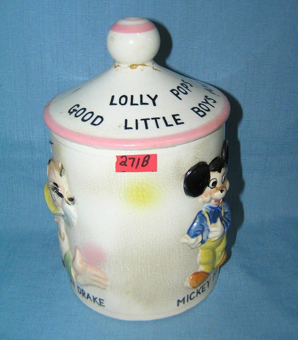 Early Disney lolly pop jar dated 1961: Early Walt Disney Prductions Mickey Mouse, Donald Duck and Ludwig von Drake lolly pop jar with lid, dated on base 1961 condition as found top is complete but reglued est. value $80.00-$100.00