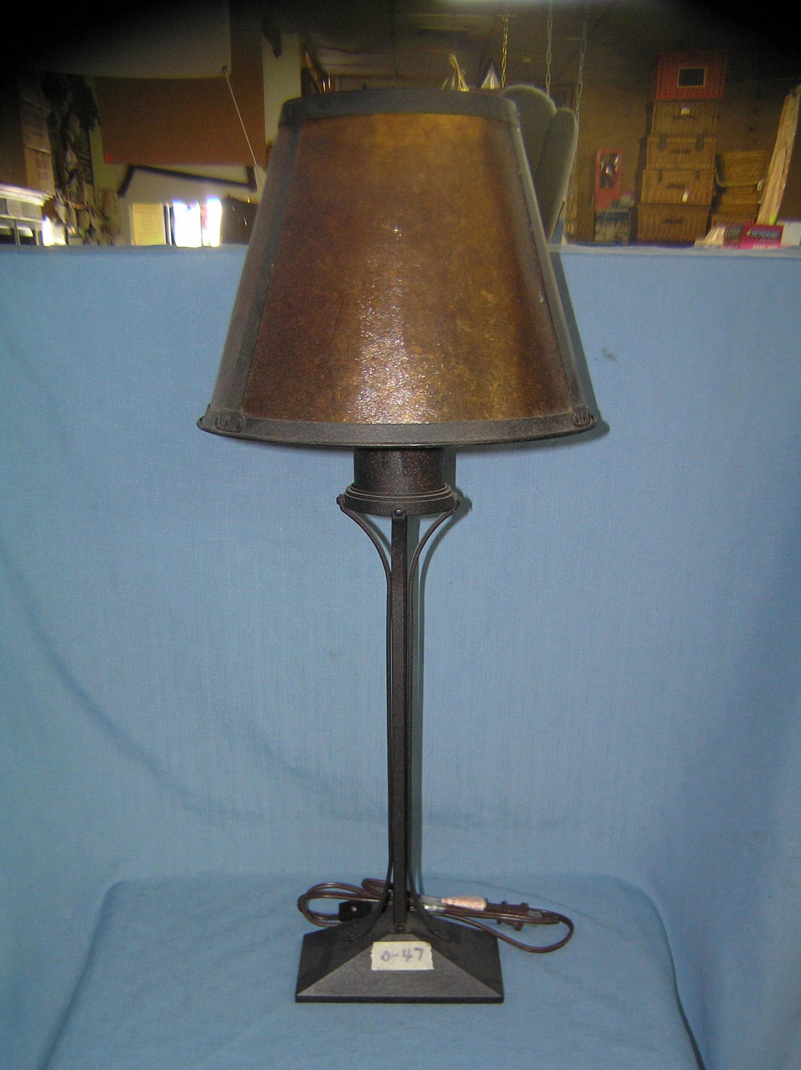 Antique style wrought iron table lamp: Antique style wrought iron table lamp with orange celluloid style shade est. value $50.00-$60.00