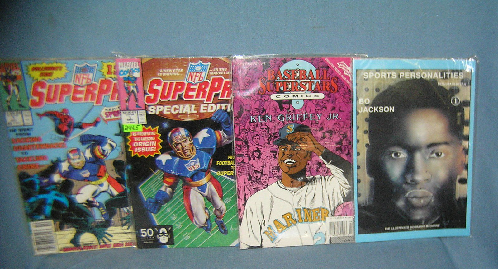 Group of 4 sport related comic books: Group of 4 sport related comic books includes ken Griffy Jr. and bo jackson and 2 first conditions est. value $40.00-$45.00