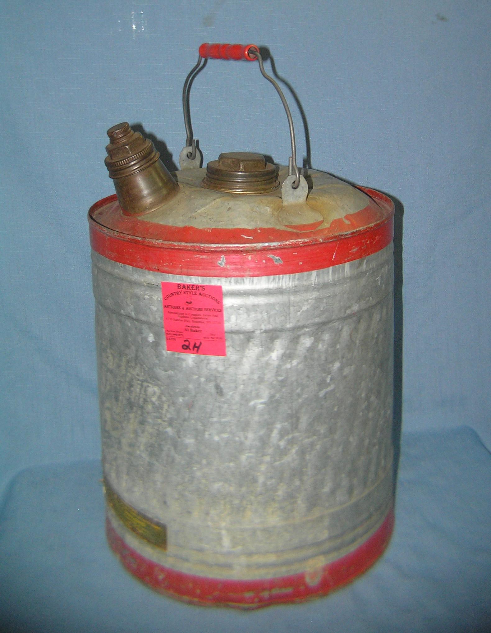 Antique farm can with wood handle: Antique farm can with wood handle circa 1930's est. value $35.00-$40.00 moving and storage co. seized merchandise